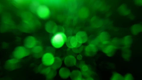 Light flare on abstract glowing light on a green background Stock Footage 104674952