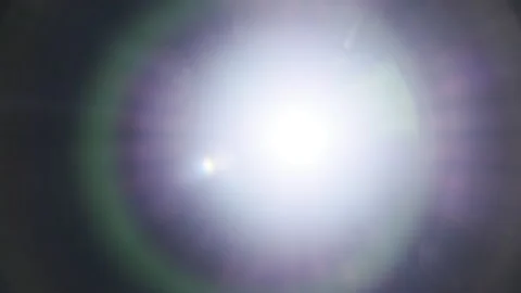The Light of a Flashlight Into the Camera on a Black Background Stock Footage 229489577