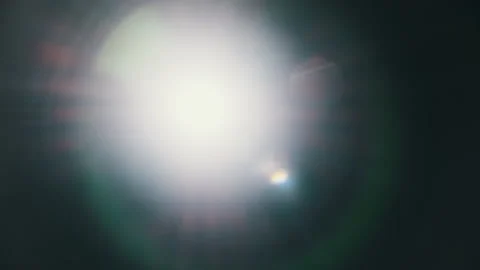 The Light of a Flashlight Into the Camera on a Black Background Stock Footage 237044357