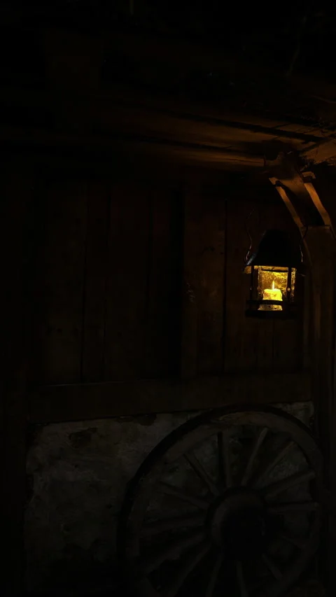 Light flickers in a rustic barn with shadows dancing around Stock Footage 331831490