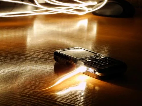 Light flies into a  old push-button telephone Stock Photos