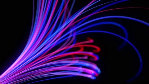 Light flow bg in 4k. Abstract looped background with light trails, stream of red Stock Footage 136431594