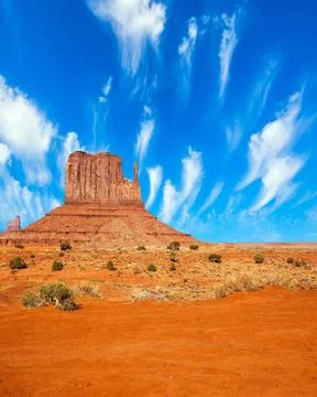 Light flying clouds Monument Valley is unique geological formation. The US... Stock Photos