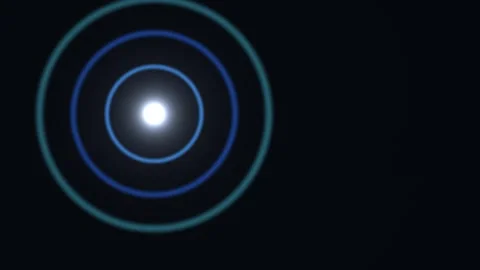 Light formation with circular rings expanding in dark Stock Footage 338288664
