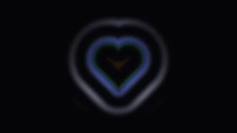 Light forms a heart shape in a dark background at night Stock Footage 339010205