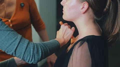 Light foundation is spread with a sponge. Texture melts into the skin Stock Footage 308469278