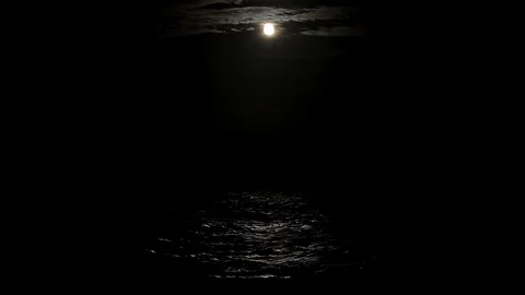 The light of the full moon is reflected in the sea water, the full moon in the Stock Footage