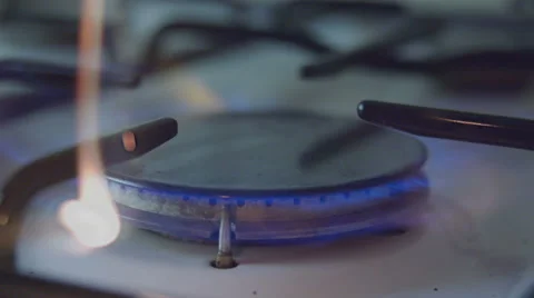 Light a gas cooker manually with match slow motion Stock Footage 57639078