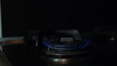 Light a gas cooker manually with slow motion Stock Footage 196430797