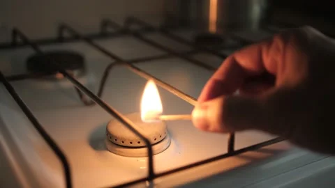 Light The Gas Stove Manually With A Slow Motion. A burning match. Soft selective Stock Footage 161328684