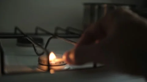 Light The Gas Stove Manually With A Slow Motion. A burning match. Soft selective Stock Footage 161329026