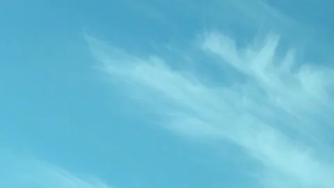 Light gentle feathery clouds flying across the azure pure sky in sunlight, beaut Stock-Footage 314318809