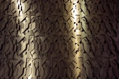 Light glow on grill pattern. Dark industrial abstract background. Stock Photos