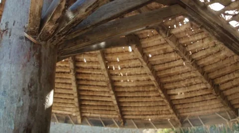 Light glowing through wooden beach umberella Video stock 45657357