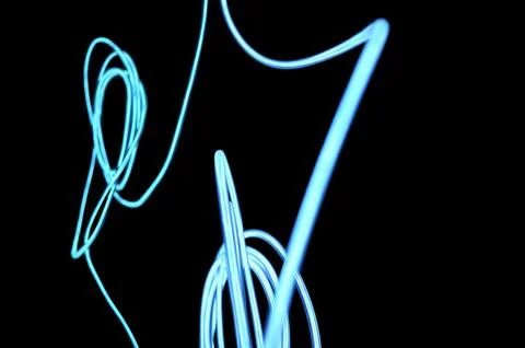 Light glowing wire electro-luminescent cable with neon, white neon light, color Foto stock