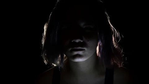 Light goes out on spooky kid in the dark Stock Footage 122357141