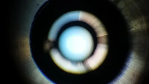 Light gradation on an out of focus camera lens. Stock Photos