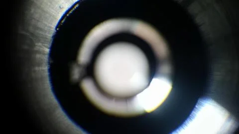 Light gradation on an out of focus camera lens. Stock Photos