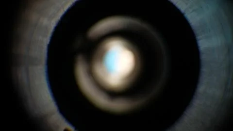 Light gradation on an out of focus camera lens. Stock Photos