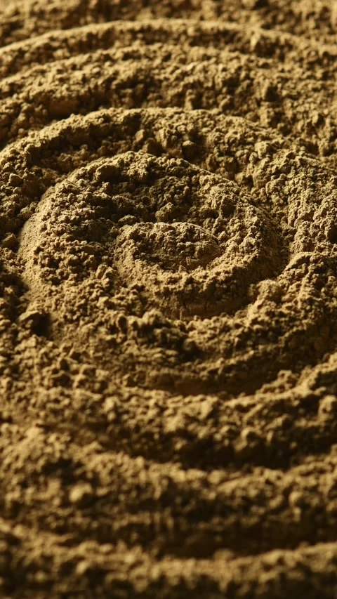 Light gradually reveals spiral hojicha powder texture in close up for tea, food, Stock Footage 341505291