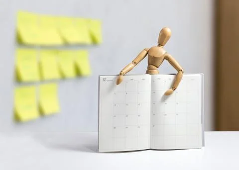 Light gray agenda. space to write. wooden doll Stock Photos