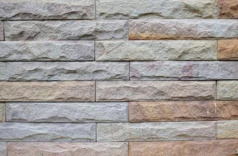 Light gray and brown brick wall. Stock Photos