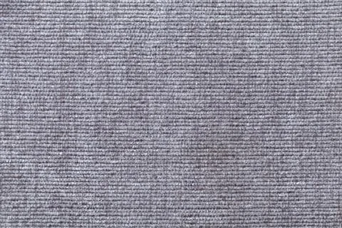 Light gray background from soft textile material. Fabric with natural texture Stock Photos