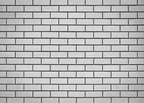 Light gray brick wall. Abstract background for design. Backdrop for displayin Foto stock