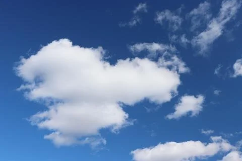 Light gray clouds against a blue sky. 스톡 사진