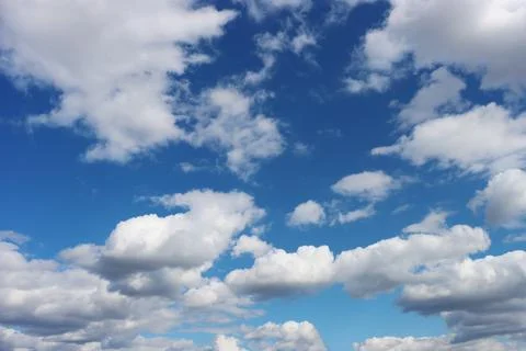 Light gray clouds against a blue sky. Stock Photos