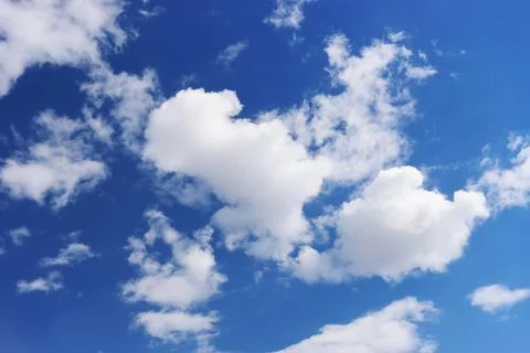 Light gray clouds against a blue sky. Stock Photos