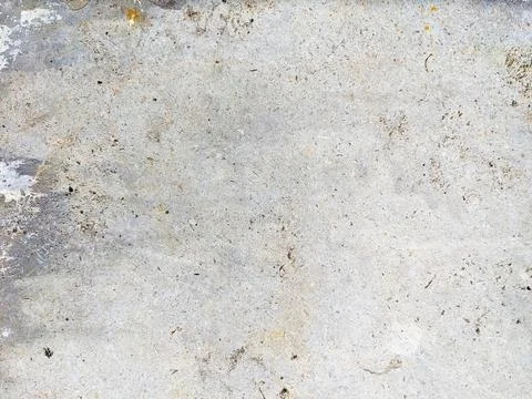 Light gray concrete surface texture with scratches and stains in close up Stock Photos