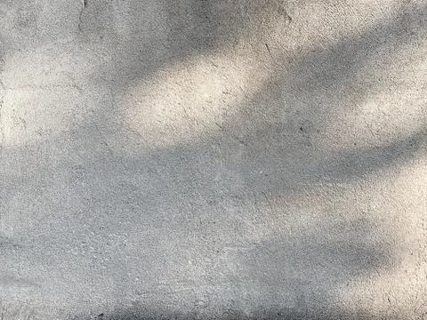 Light gray concrete wall texture with shades of light Stock Photos