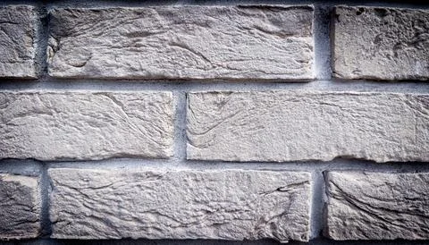 Light gray decorative stone brick wall texture background for facade claddi.. 스톡 사진