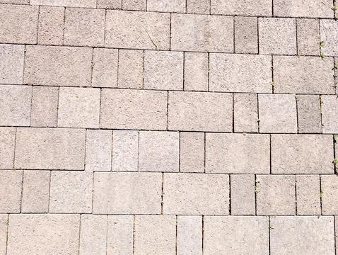 Light gray interlocking stone pavement surface Stock Photos