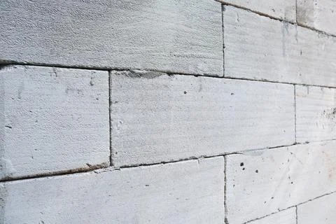 Light gray lightweight concrete block or autoclaved aerated concrete AAC br.. Stock Photos