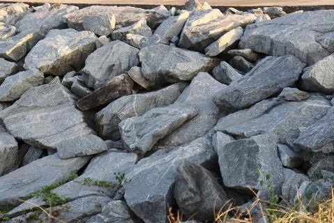 Light gray rock found on side of the beach Stock Photos