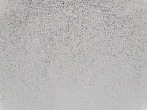 Light gray rough plaster wall texture background Stock Photos