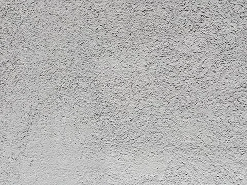 Light gray rough plaster wall texture background Foto stock