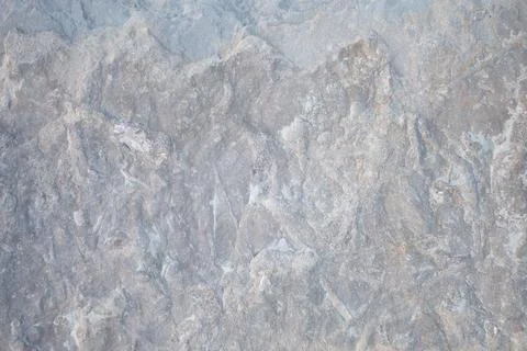 Light gray stone surface, abstract rocky background with cracks Stock Photos