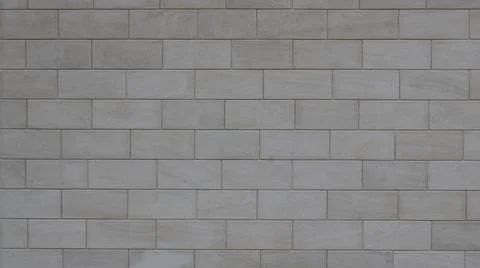 Light gray stone wall with blocks Stock Photos