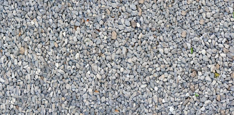 Light gray stone wall texture. Gray pebble dash panoramic background Foto stock