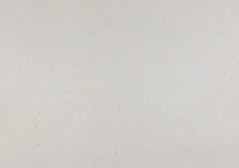 Light gray texture of paper wallpaper or plaster with barely noticeable str.. Stock Photos