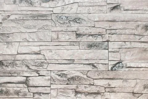 Light gray texture of a stone wall. Stock Photos