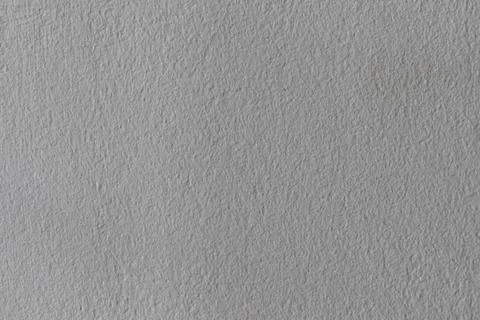 Light gray textured background with rough surface. Stock Photos