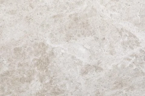 Light gray textured stone surface with subtle patterns ideal for interior design Stockfoto's