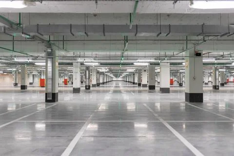 Light gray underground parking without cars, free and empty. Stock Photos