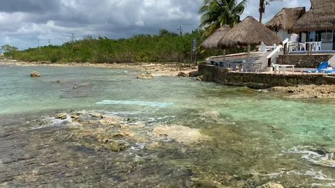 Light green and blue clear Caribbean water over rocks Stock Footage 106636624