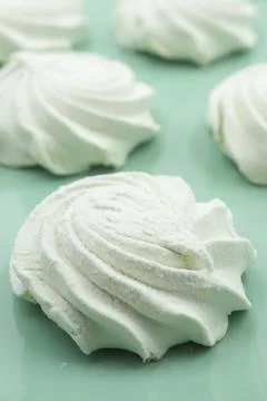Light green apple marshmallows on a light green plate, close-up Stock Photos