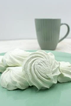 Light green apple marshmallows on a light green plate, close-up Stock Photos